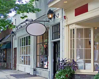 Case Study Row of retail shops with plants and high end details.