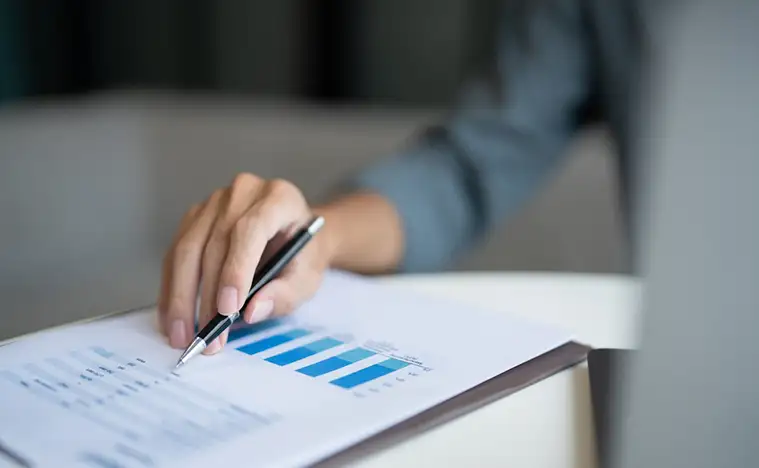 A business man looks over reports.